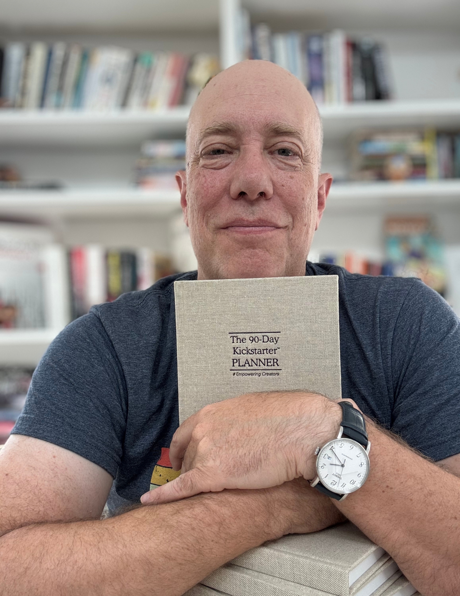 Amir Avitzur holding the 90-Day Kickstarter Planner